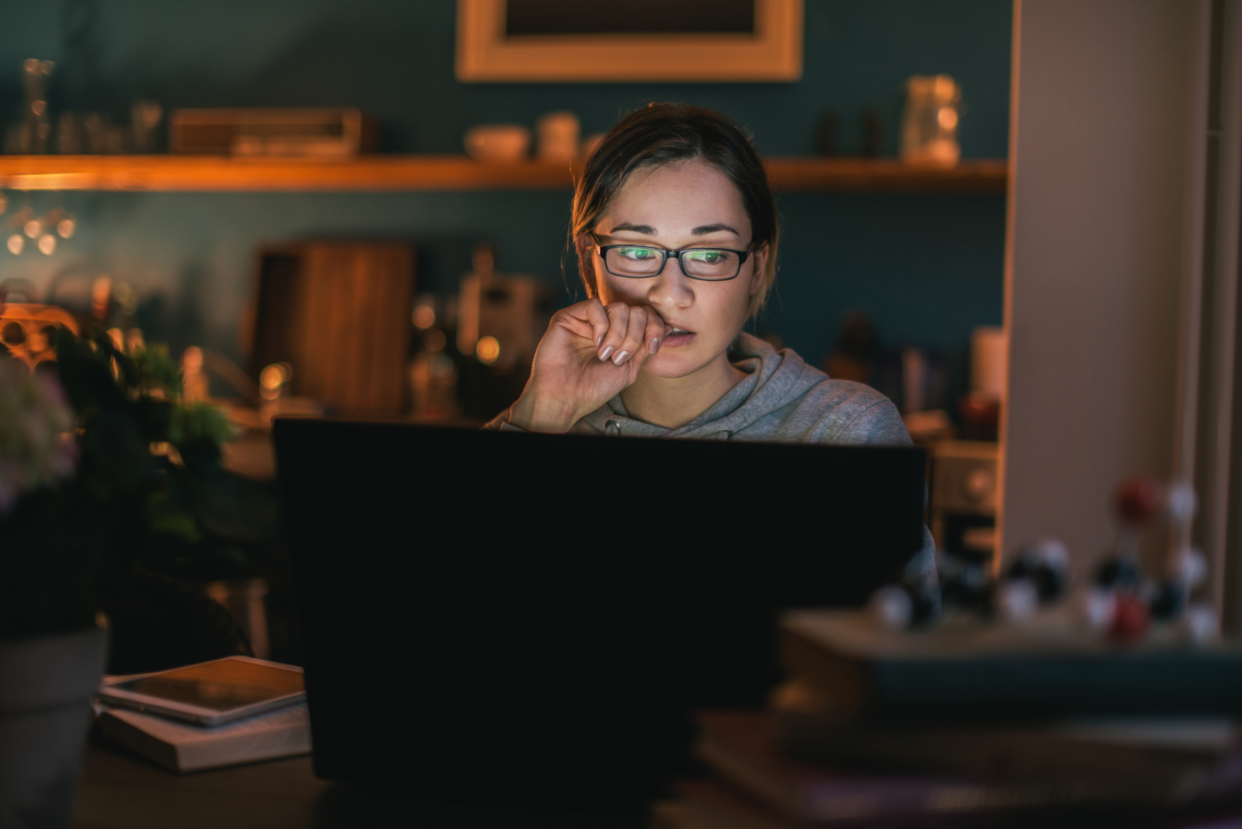 a person on their computer at night