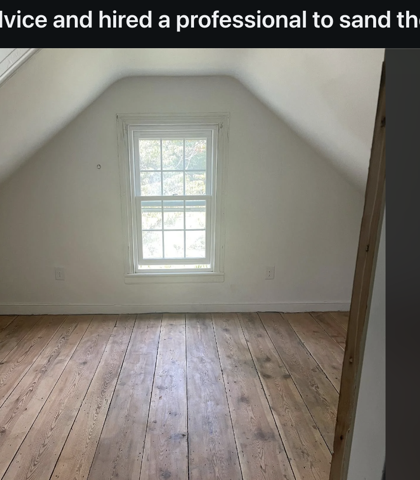 A renovated room with sanded wooden floors