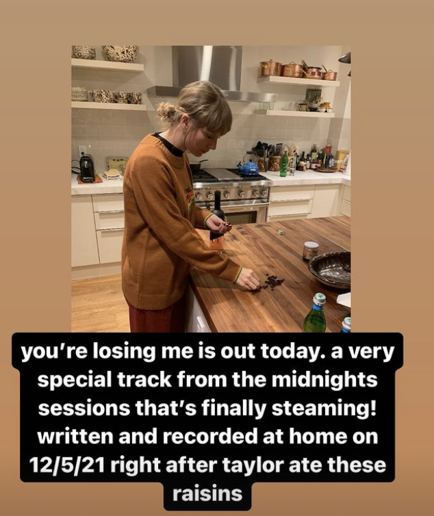 Taylor Swift in a kitchen eating raisins with text: &quot;You’re Losing Me is out today. A very special track from the Midnights sessions that’s finally streaming!&quot;