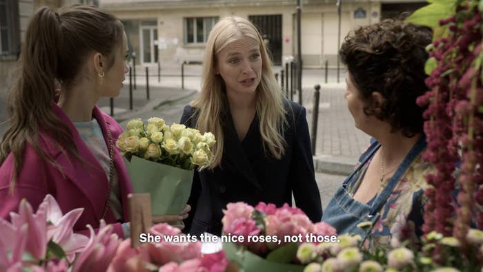 Camille helps translate for Emily and the flower seller on Emily in Paris