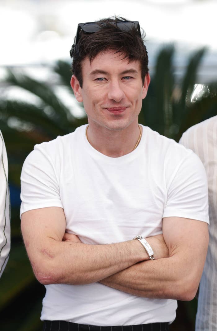Closeup of Barry Keoghan with his arms crossed