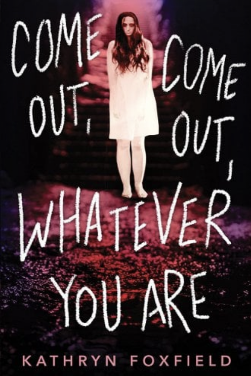 Book cover of &quot;Come Out, Come Out, Whatever You Are&quot; by Kathryn Foxfield, featuring a person in white standing with text in bold handwritten-style font