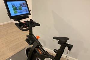 NordicTrack exercise bike S22i with an attached touchscreen displaying a scenic cycling route