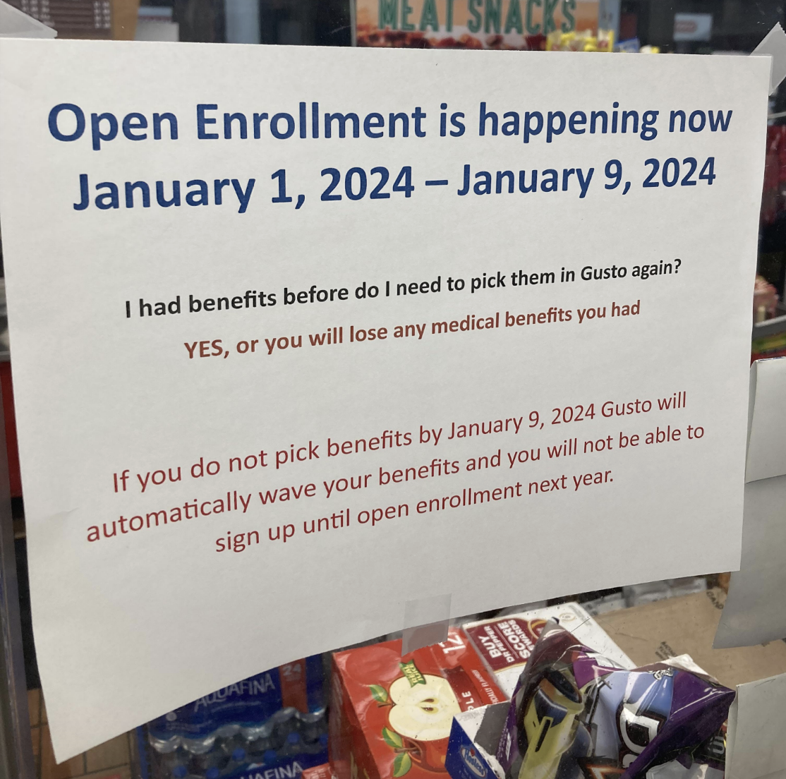 Sign reads: &quot;Open Enrollment is happening now January 1, 2024 - January 9, 2024; pick benefits by January 9, 2024, or lose medical benefits; automatic loss if not selected.&quot;