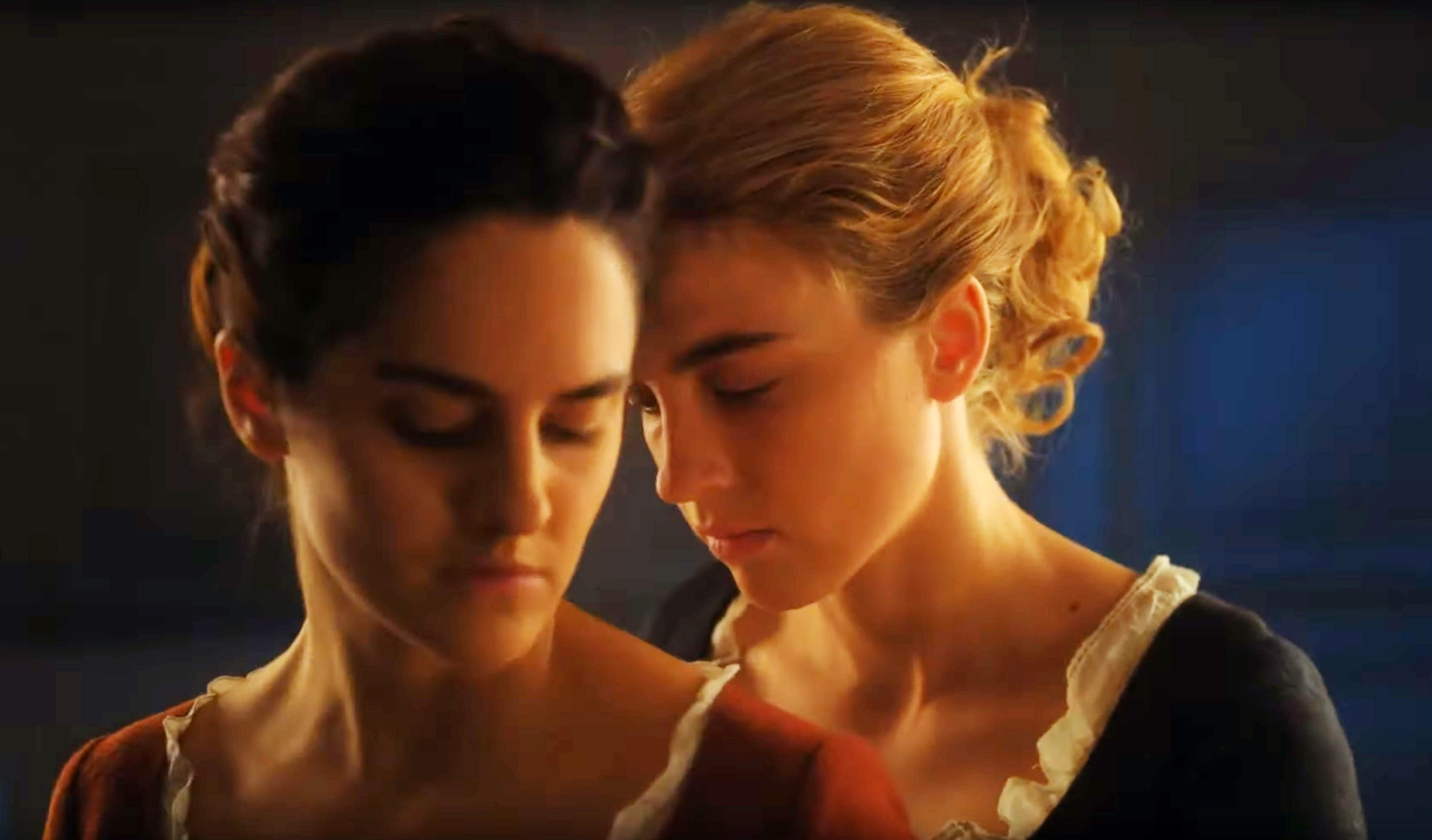 Adèle Haenel and Noémie Merlant in a close pose from the film &quot;Portrait of a Lady on Fire.&quot;