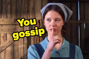 Mia Goth in a farm-like setting, wearing a blue bandana and overalls, with a finger to her lips and the text "You gossip" beside her