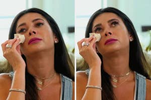 A woman, possibly from a TV show or interview, is seen in two side-by-side images wiping her tears with a tissue, appearing emotional and distressed