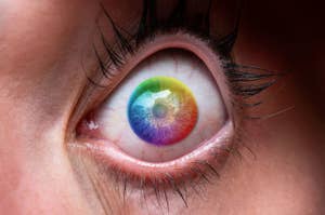 Close-up of a human eye with a rainbow-colored iris