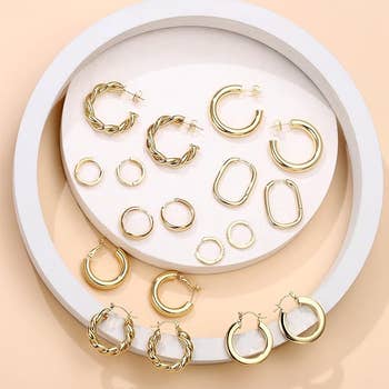 Assorted gold hoop earrings 