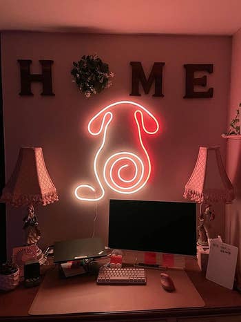 the govee rope light in the shape of a puppy, above a desk