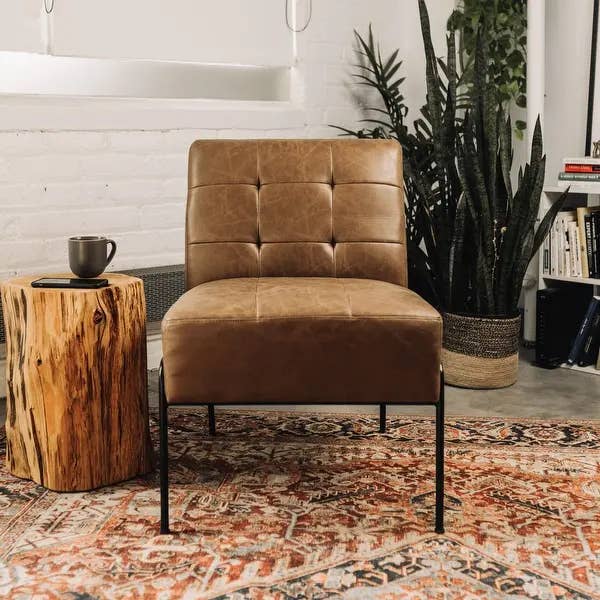 a brown faux leather tufted accent chair