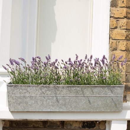 Embossed galvanised metal window trough