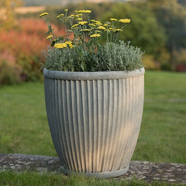 Tall antique zinc dolly pot