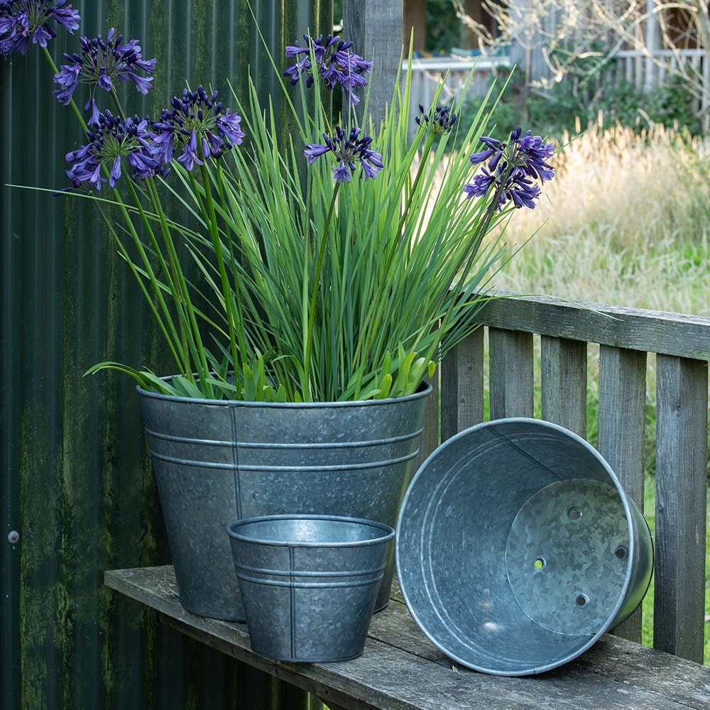 Ringed galvanised metal planter