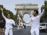 Who is carrying the Olympic torch through Paris? A BTS star, a garbage collector and more