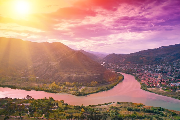 Evening panoramic view of Mtskheta city and Kura river Georgia country