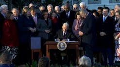 President Joe Biden signs the Bipartisan Infrastructure Deal into law on Nov. 15, 2021.