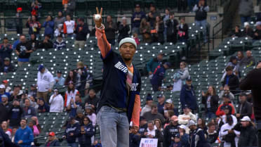 Amon-Ra St. Brown throws out the first pitch