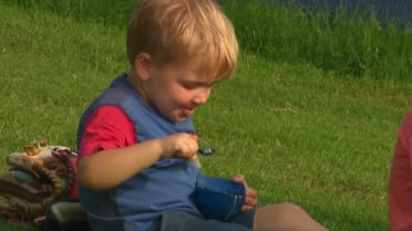 A young Mets fan enjoys some pregame ice cream