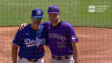 Eric and Kyle Karros exchange lineup cards