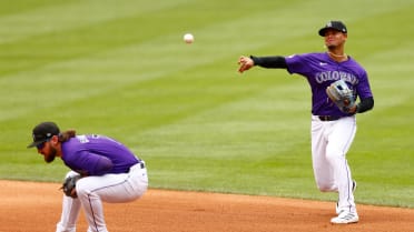 Rockies turn double play off a deflection