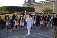 BTS' Jin carries Olympic torch near Louvre Museum