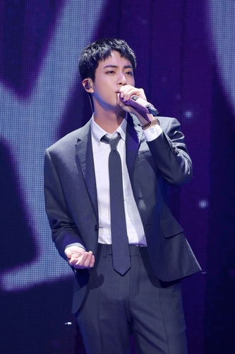 BTS member Jin sings during a meet-and-greet event for fans at the Jamsil Indoor Gymnasium in southern Seoul on June 13, 2024, in this photo provided by BigHit Music. (PHOTO NOT FOR SALE) (Yonhap)