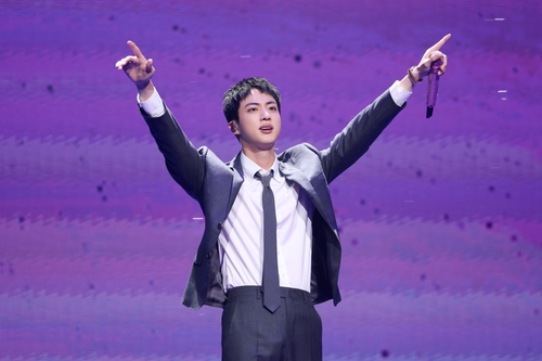 BTS member Jin gestures during a meet-and-greet event for fans at the Jamsil Indoor Gymnasium in southern Seoul on June 13, 2024, in this photo provided by BigHit Music. (PHOTO NOT FOR SALE) (Yonhap)