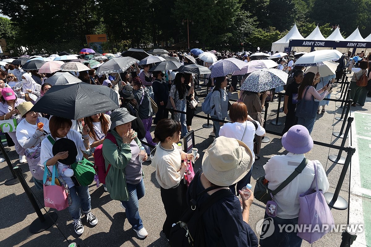 Fans of K-pop sensation BTS wait in line to attend 2024 BTS Festa, an annual event hosted by BTS' agency, BigHit Music, to celebrate the band's debut anniversary, at the Seoul Sports Complex in southern Seoul on June 13, 2024. (Yonhap)