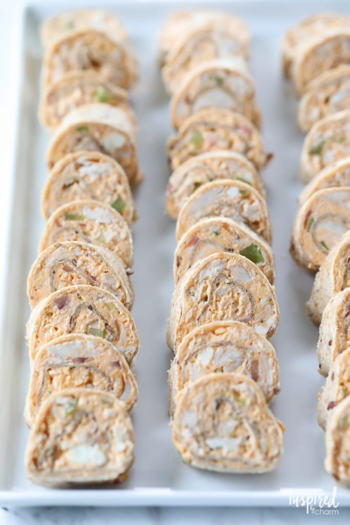 Buffalo chicken roll ups on a large platter