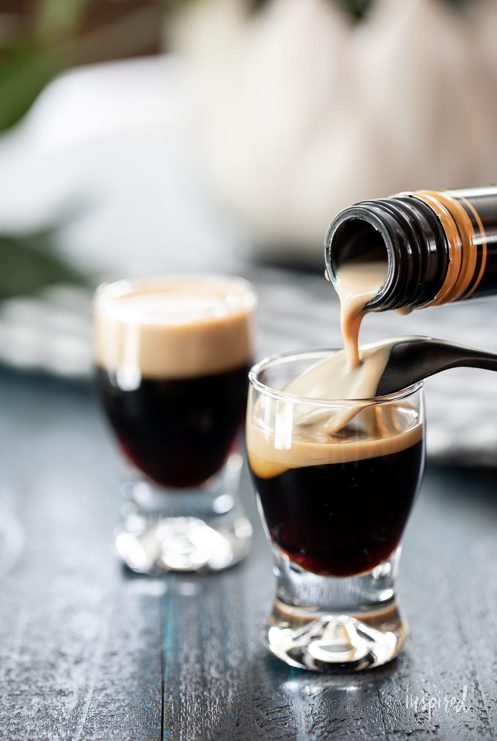 pouring a mini Guinness shot.