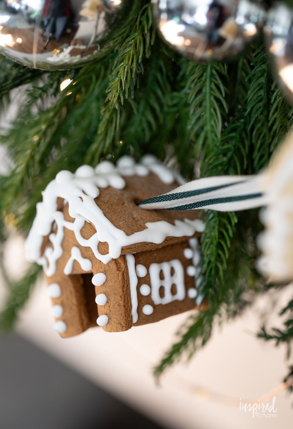 mini gingerbread house hung with ribbon.