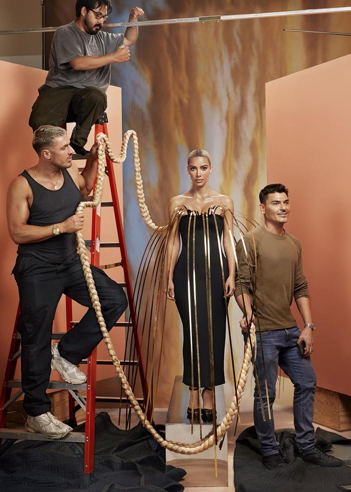 Portrait of kim kardashian on set of her allure cover shoot. She's surrounded by hairstylist Chris Appleton, set assistant Mark Smith, and makeup artist Mario Dedivanovic.