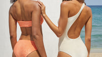 Two girls modeling the back of our Ava Top, Lure Bottom and Evolve One Piece in Horizon and Sandstone Terry Sheen