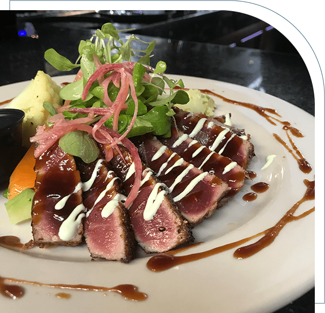 A plate of food with meat and vegetables on it.