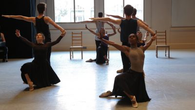 three couples with female dancers on their knees and men facing window