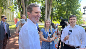 Gov. Andy Beshear told reporters Monday that his being mentioned as a possible presidential contender is a positive reflection on Kentucky. The governor had just spoken at a celebration of Kentucky State Parks' 100th anniversary. (Kentucky Lantern photo by McKenna Horsley)