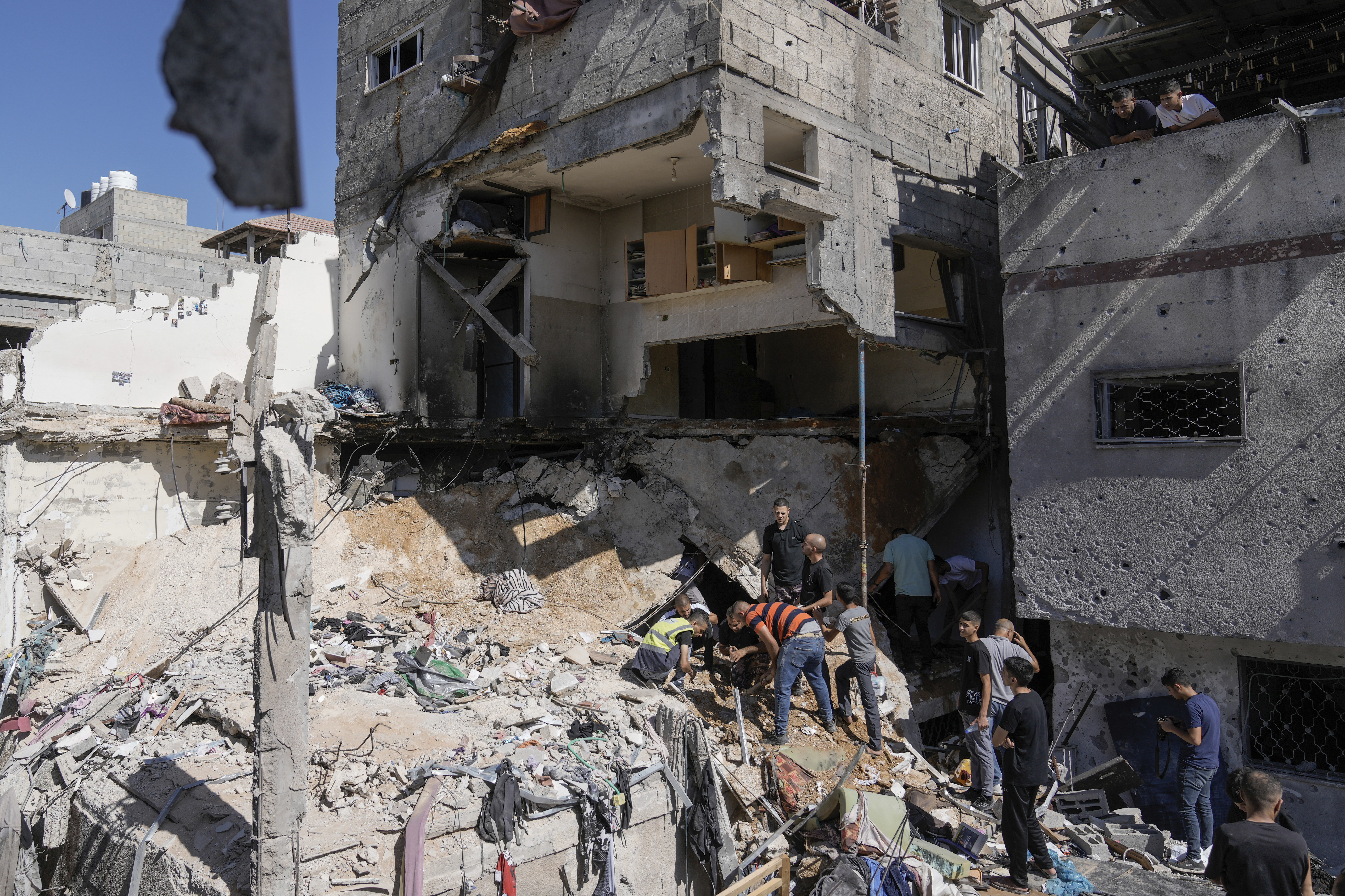 Palestinians inspect the destruction following an Israeli operation in Nur Shams refugee camp, near the West Bank town of Tulkarem, Sunday, June 30, 2024. Palestinian health officials said one person was killed and several wounded during an Israeli operation in the Nur Shams refugee camp in the northern West Bank. Israel frequently operates in the area, saying it is a stronghold of Palestinian militants. (AP Photo/Majdi Mohammed)