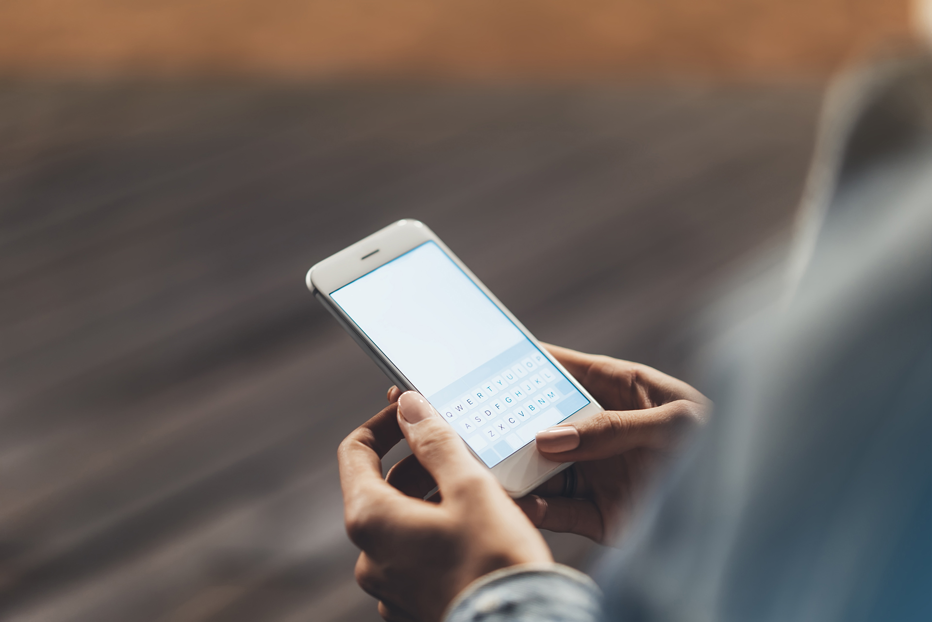 A person uses a phone to report needed services.