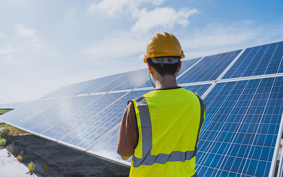 one male engineer checking the solar panel with digital tools