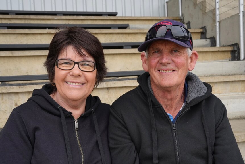 A man and woman smiling