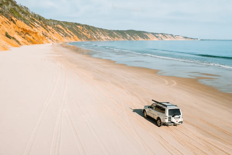 A four-wheel-drive on Teewah Beach