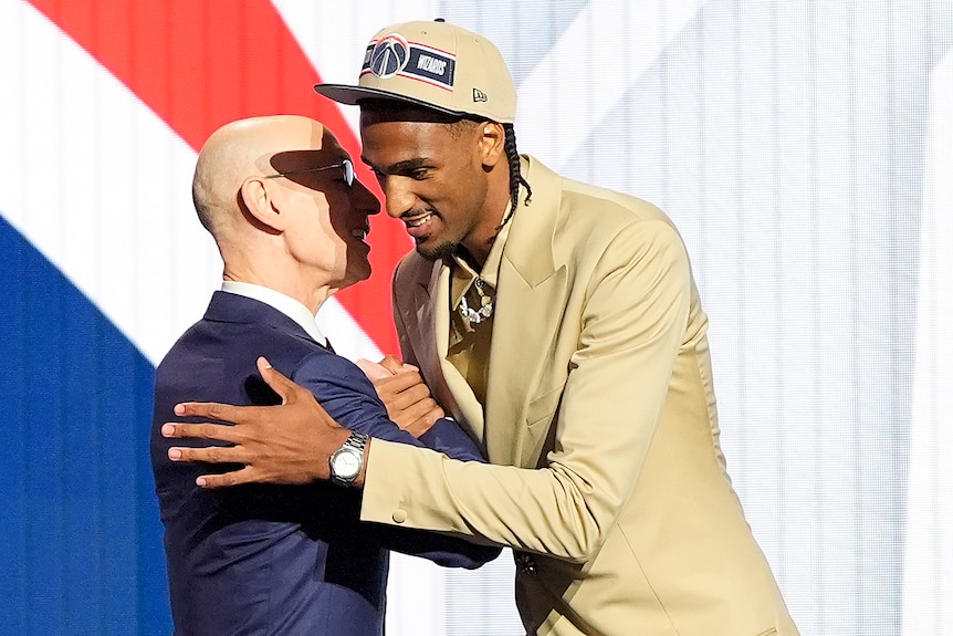 Alexandre Sarr hugs NBA commissioner Adam Silver