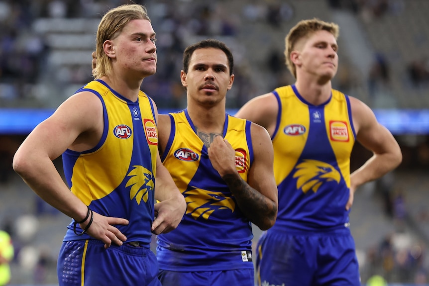 Harley Reid stands with Eagles teammates after AFL loss to Saints.