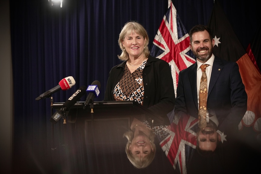 Eva Lawler and Chansey Paech smile during a press conference.