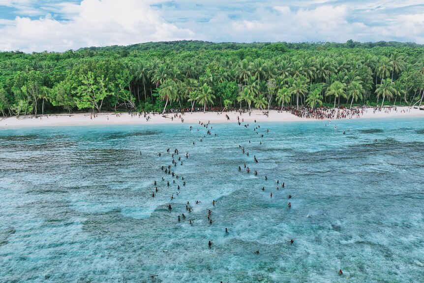 A drone shot of people on an island 