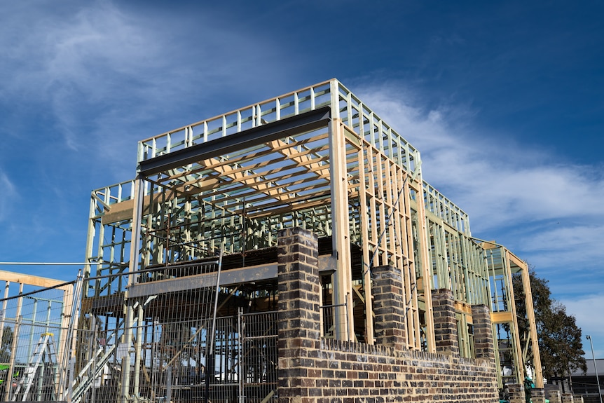 Houses under construction on a bright, sunny day