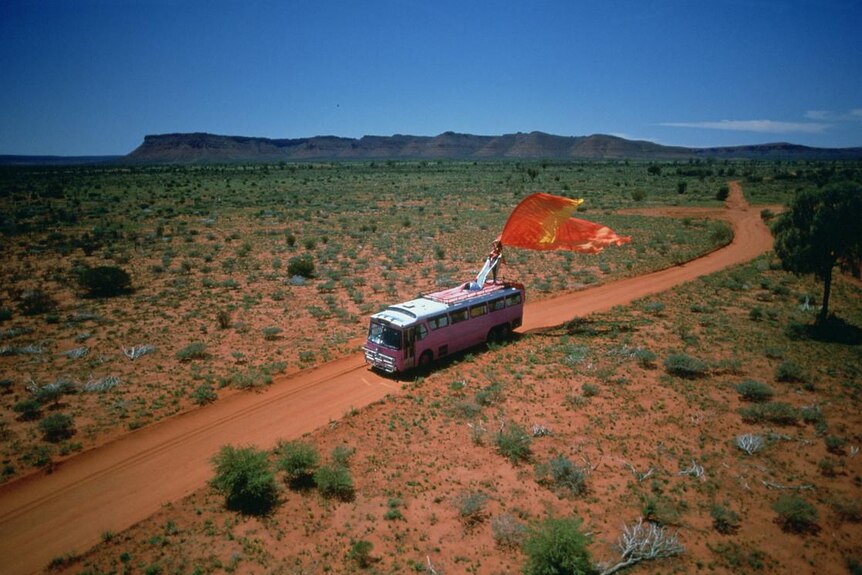 pink bus on outback road