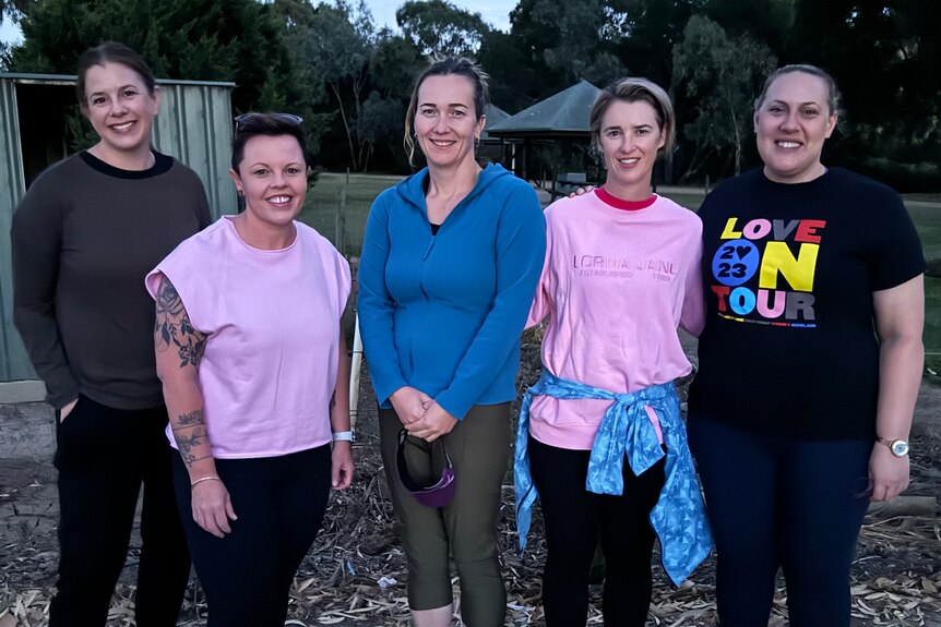 A group of women in running attire