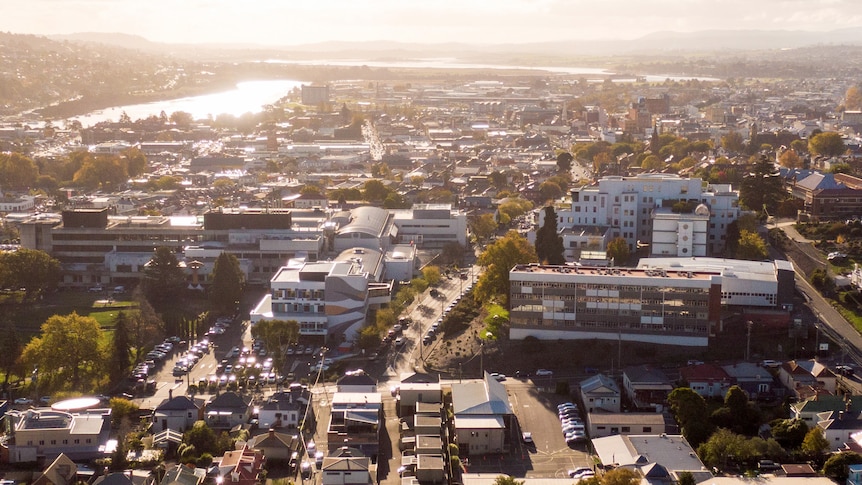 An aerial view of a city during sunset.